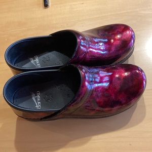 Ladies Dansko patent leather clogs.